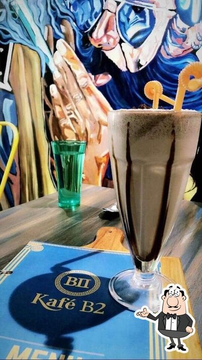 Take a seat at one of the tables at Kafé B II