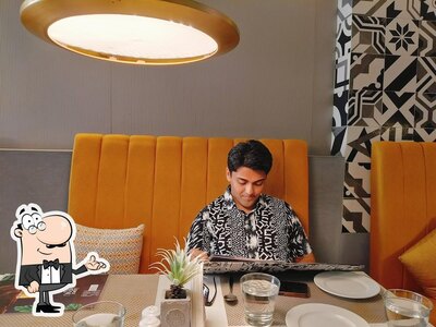 Take a seat at one of the tables at KITCHEN165