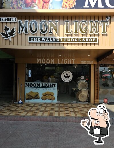 Take a seat at one of the tables at Moon Light - The Walnut Fudge Shop مون لاںٔٹ