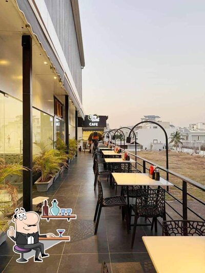 Take a seat at one of the tables at Stay Here Cafe