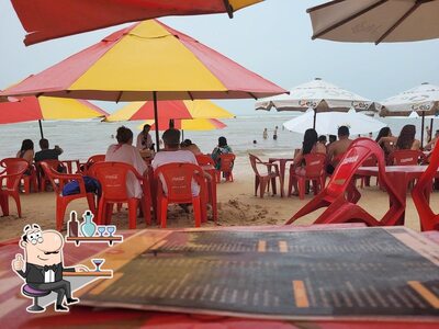 Sente em uma das mesas no Pipa's Point Restaurante