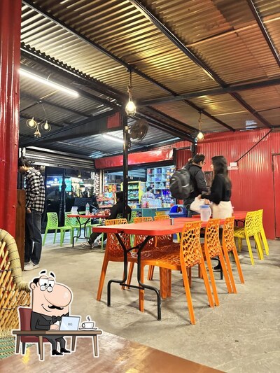 Take a seat at one of the tables at Tushar Dhaba