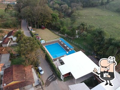 Sente em uma das mesas no Casa do Norte Gaiolodromo Extrema