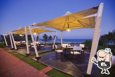 Take a seat at one of the tables at Sun Burst Poolside Bar