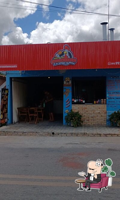 Sente em uma das mesas no Churrascaria O Macaxeira
