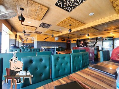 Take a seat at one of the tables at Karim's Boulevard