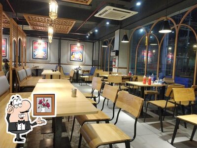 Take a seat at one of the tables at Domino's Pizza Jawahar Nagar, Srinagar