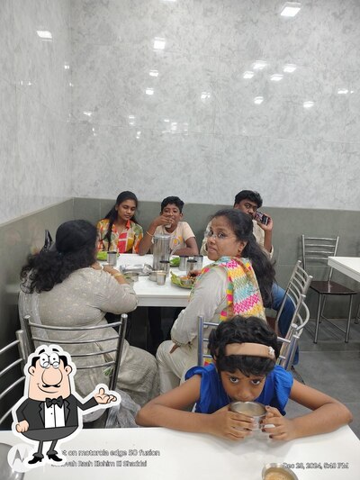 Take a seat at one of the tables at Amman Vegetarian Restaurant