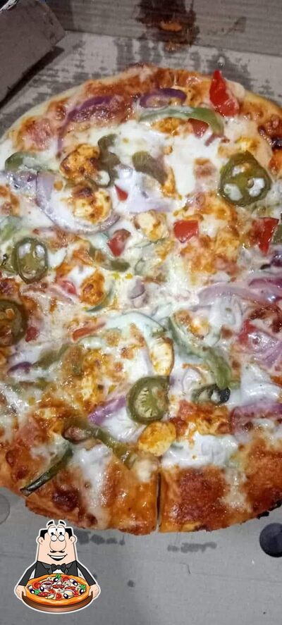 Try out pizza at Delicious Pizza Cafe
