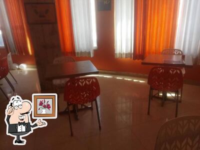 Take a seat at one of the tables at Pet Pooja