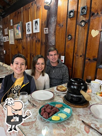 Sente em uma das mesas no Casa de Fondue Aargau