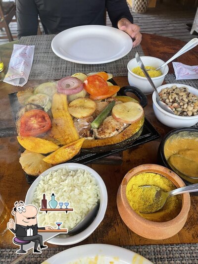 Sente em uma das mesas no Tempero da Dê