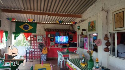 Sente em uma das mesas no MINI RESTAURANTE SITIO DAS TORTAS