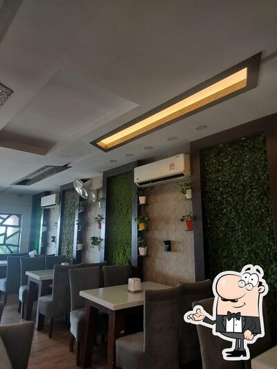 Take a seat at one of the tables at New Break Point Restaurent
