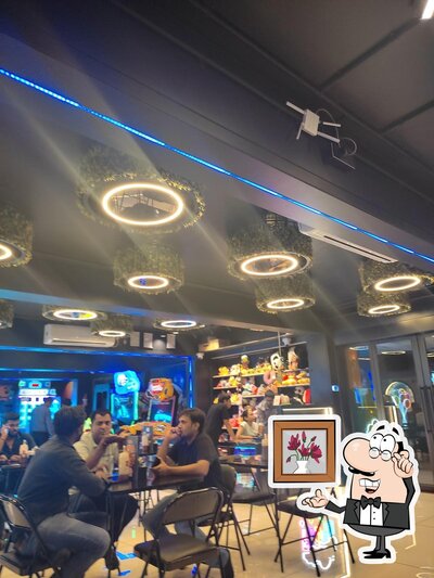 Take a seat at one of the tables at Fun4u Gamezone - Game zone in Navsari