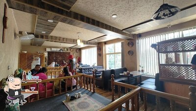 Take a seat at one of the tables at SALAM E WAZWAN