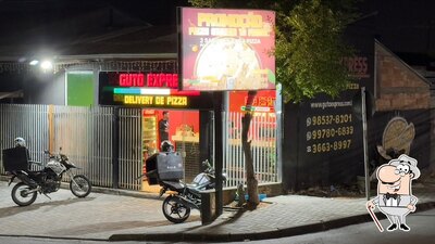 O exterior do Pizzaria guto express delivery