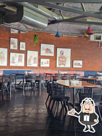 Take a seat at one of the tables at Horn Ok Please Dhaba
