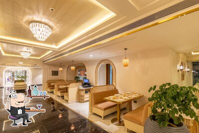 Take a seat at one of the tables at Zaffran- Renaissance Hotel