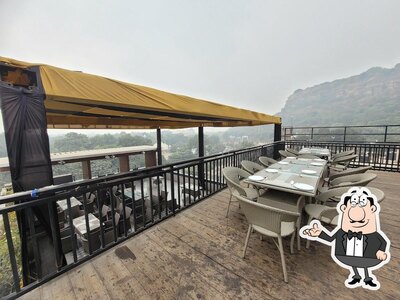 Take a seat at one of the tables at Hotel Gold Inn