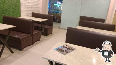 Take a seat at one of the tables at The Pizza Bite