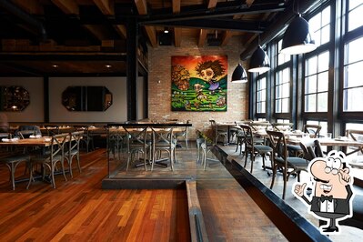 Take a seat at one of the tables at Canadian Dhaba