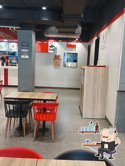 Take a seat at one of the tables at KFC
