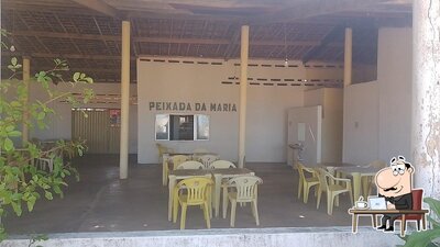 Sente em uma das mesas no Restaute e Peixada Da Maria