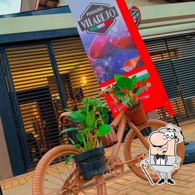 Descubra a área externa do Pizzaria Vilarejo
