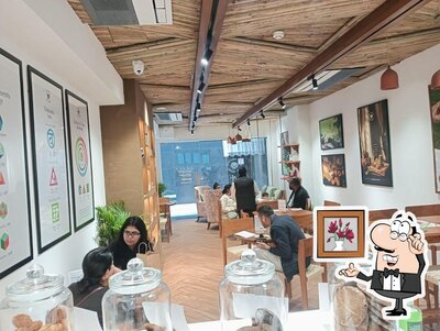 Take a seat at one of the tables at Café Swasthya