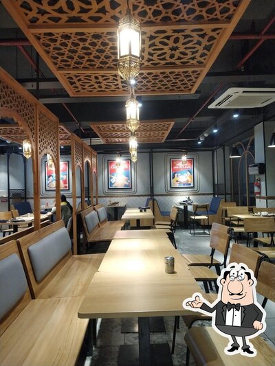 Take a seat at one of the tables at Domino's Pizza Jawahar Nagar, Srinagar