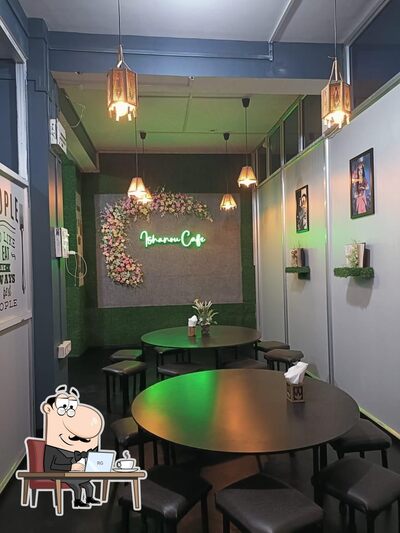 Take a seat at one of the tables at Ishanou Cafe