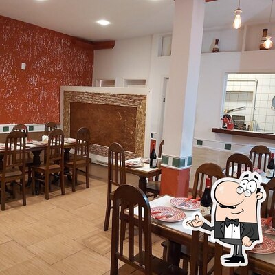 O interior do Raffinato Pizzaria