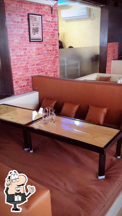 Take a seat at one of the tables at Ssl Mandi House