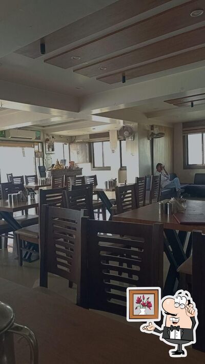 Take a seat at one of the tables at KATHIYAWADI DHABA