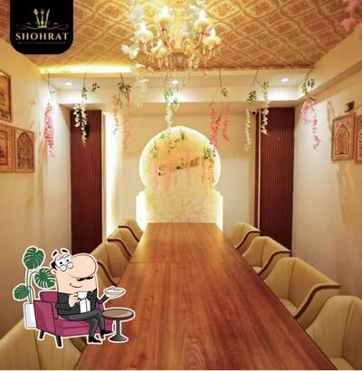 Take a seat at one of the tables at Shohrat Multicuisine Restaurant
