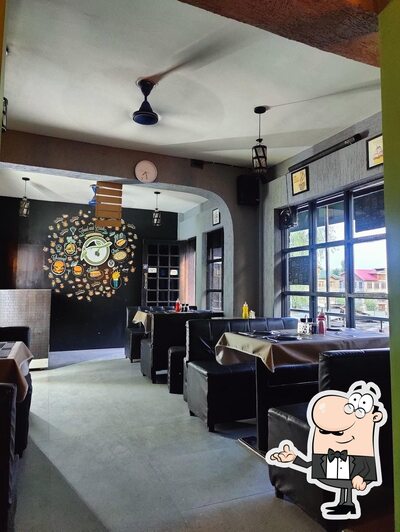 Take a seat at one of the tables at Black olive