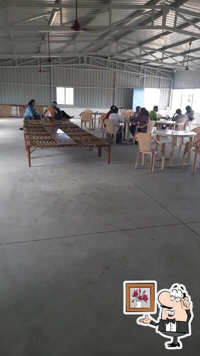 Take a seat at one of the tables at Runicha ramdev dhaba