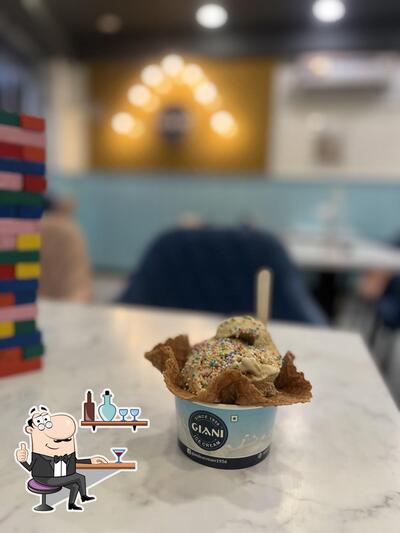 Take a seat at one of the tables at Giani Ice Cream (Since 1956)