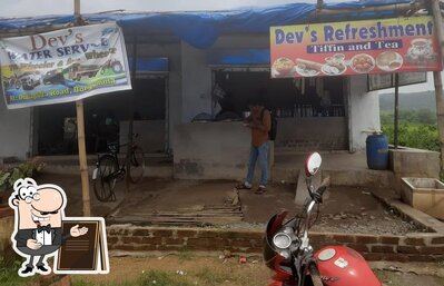 You can get some fresh air outside Dev,s Refreshment