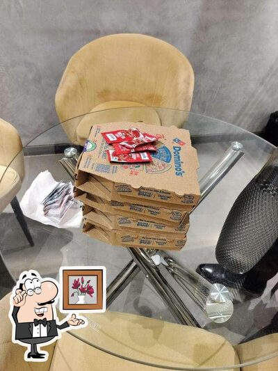 Take a seat at one of the tables at Domino's Pizza