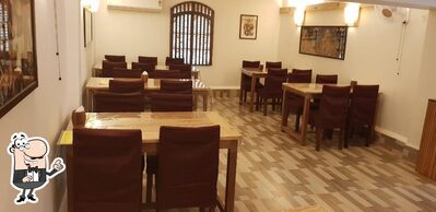 Take a seat at one of the tables at Little Goa Bar & Restaurant Bhatkar