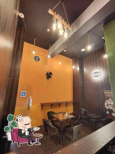 Take a seat at one of the tables at Cafe@22