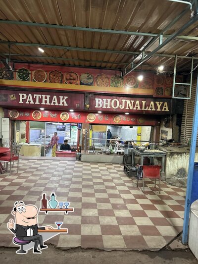 Take a seat at one of the tables at PATHAK BHOJANALAYA