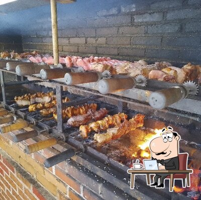 Sente em uma das mesas no Churrascaria e lanchonete TEXA GRILL
