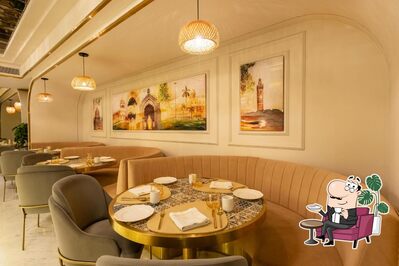 Take a seat at one of the tables at Zaffran- Renaissance Hotel