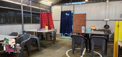 Take a seat at one of the tables at Oru vallatha kada