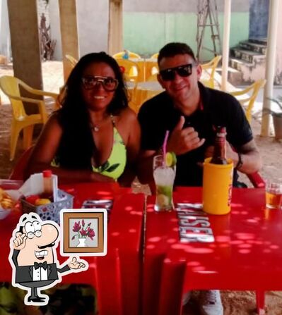 Sente em uma das mesas no Restaurante Mourão