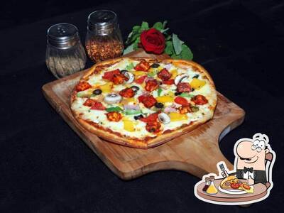 Try out pizza at Spice Rack Cafe