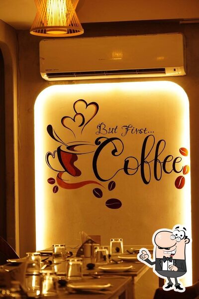 Take a seat at one of the tables at Raada Resto And Cafe